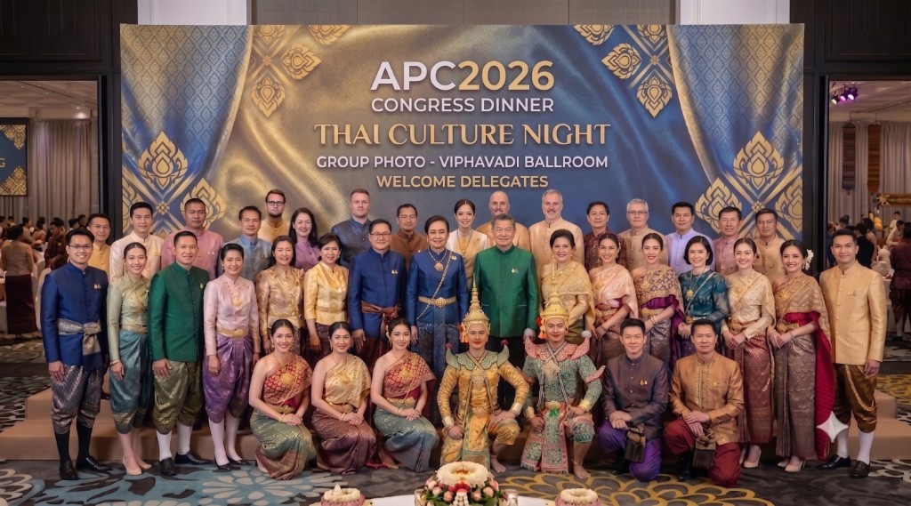 Delegates in traditional Thai costume at APC 2026 Congress Dinner group photo, Vibhavadi Ballroom